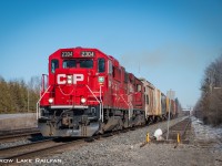 CP F52 throttles up as it comes off the Prescott spur and heads back to the Smiths Falls yard. CP 3100 would cover us in smoke after it passed.