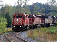 CP GP38-2 3108, SOO Line SD40-2 units 6601 and 6621 curve through the west connecting track to the Galt Sub, coming off CP's Hamilton Sub at Guelph Junction.