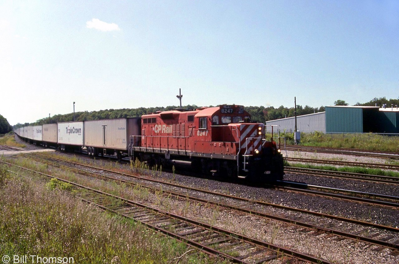CP GP9u 8247 heads eastbound on the Galt Sub through Guelph Junction with the Roadrailer. Power was often a single unit such as a GP38-2, C424 or GP9u.