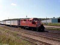 CP GP9u 8247 heads eastbound on the Galt Sub through Guelph Junction with the Roadrailer. Power was often a single unit such as a GP38-2, C424 or GP9u.