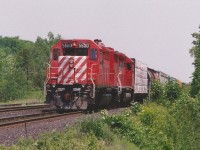 CP SD40 5500 and SD40M-2 5490 are on the Guelph Junction Turn lifting and setting-off cars at Guelph Junction during a hazy summer afternoon. SD40 5500 was retired during 2001 and was later donated to the Revelstoke Railway Museum in Revelstoke B.C. in 2007. 