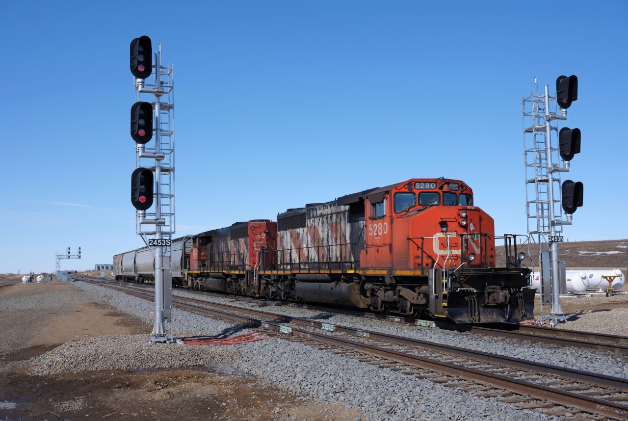 CN 501 shoves west through the new "Biggar East". The recently completed double-track program in the area has brought many changes to the area, one can only imagine how many changes the 5280 and mate 5276 have witnessed throughout the years.