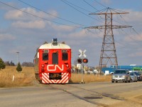 CN TEST RDC 1501 returns northbound towards Guelph crossing Highway 24 after testing south on the Fergus spur to Preston.  This day found O999 running from Stratford to Kitchener, testing the Huron Park spur, and continuing to Guelph for this Preston trip.  The train would later tie down at Guelph.