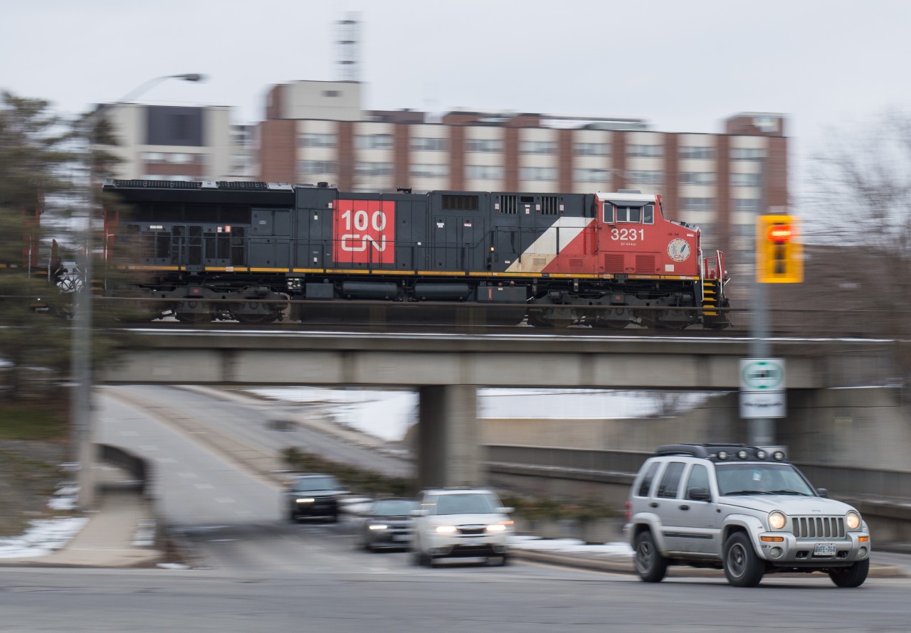 During the month of February rail blockades on the CN Kingston Sub made traffic patterns in Southern Ontario to be pretty sporadic at times.  I learned of CN 3231 leading on CN 396 on a grey February afternoon and not being too motivated to go for a drive I chose to walk outside of my apartment building and set up for a pan shot of the train crossing St Paul Avenue in Brantford.  The amount of new GEVOs on CN is making trains on the line pretty cookie cutter, so mixing it up a little seemed to be a good call.
