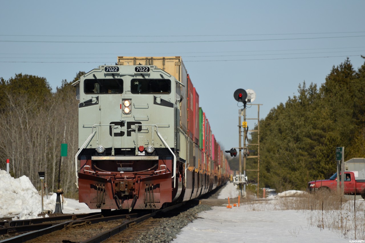 CP 7022 is coasting on the tail end of CP 119 after a defective traction motor blower stopped the unit from loading beyond a certain speed, the sharp looking rebuild would limp off to Winnipeg like this for some attention from the shop, a long ways to go from Signal 673 on the MacTier sub!