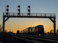 As the sun begins its final descent of the day, CN 434 begins its work at Paris Junction behind a pair of GE C40-8M's.  In the last year, CN has become saturated with GEVOs so a pair of cowls was a nice change of pace.  Rumour has it that the cowls are running on borrowed time, the setting sun could serve as a nice metaphor in the near future...