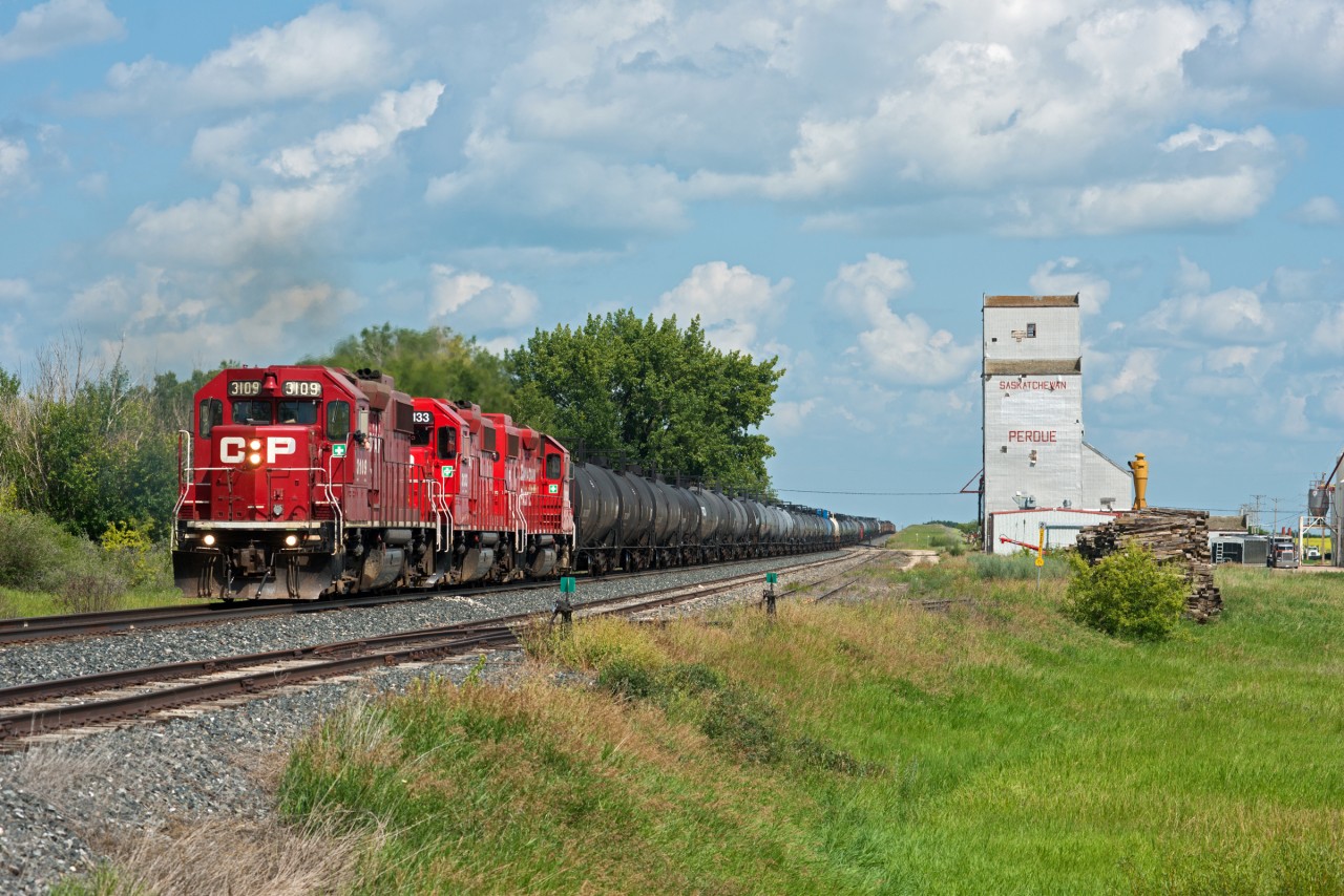 On a hot and muggy July afternoon, CP 467 is seen passing the elevator at Perdue Saskatchewan with a nice set of GP38's. This is the only elevator still standing along the Wilkie Sub.