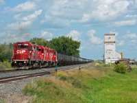 On a hot and muggy July afternoon, CP 467 is seen passing the elevator at Perdue Saskatchewan with a nice set of GP38's. This is the only elevator still standing along the Wilkie Sub. 