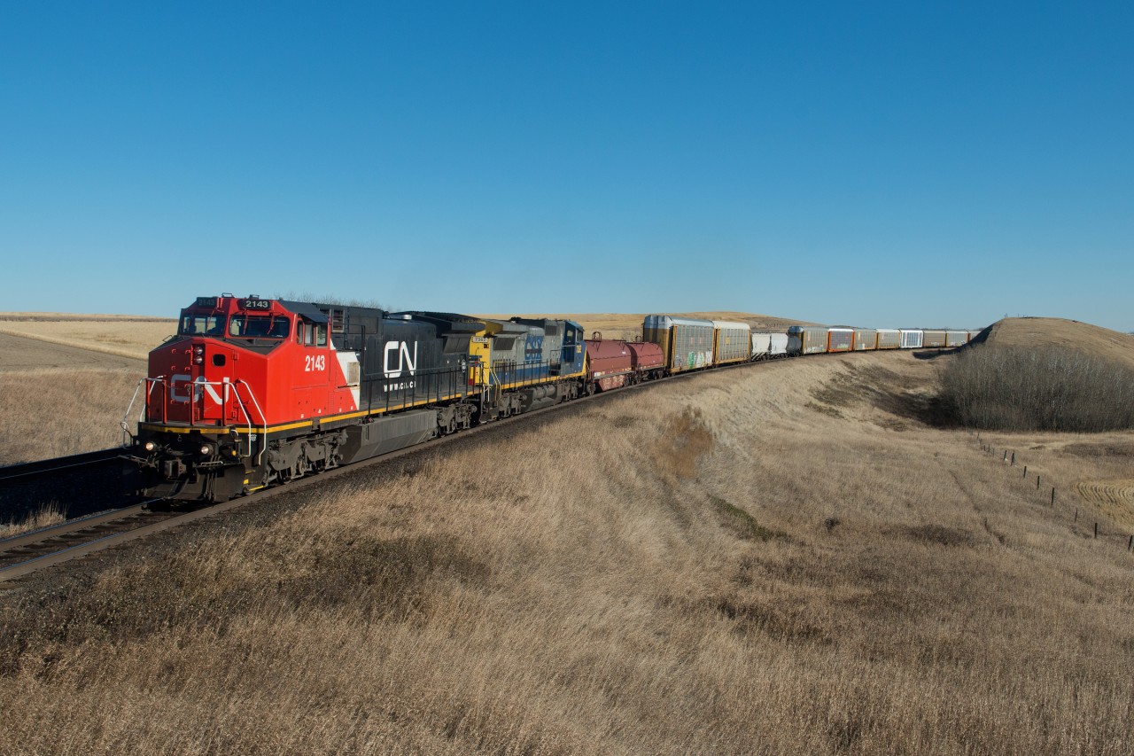 A pair of secondhand Dash8s lead 315 through the hills around Keppel Saskatchewan on a perfect October day.