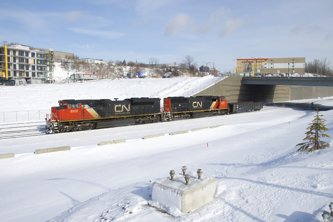 Originating at Southwark Yard, CN 321 has just passed Turcot Ouest with CN 8958, CN 5651 and just a single car and will go another 120 miles or so like this until it picks up its train at Brockville. In the wake of the blockade of CN's Kingston Sub, trains are still parked all over, some without power.