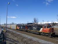 After being held a few miles west of Taschereau Yard for over an hour, CN 276 is on the move with SD75I's CN 5693 & CN 5731 for power and 112 autoracks.