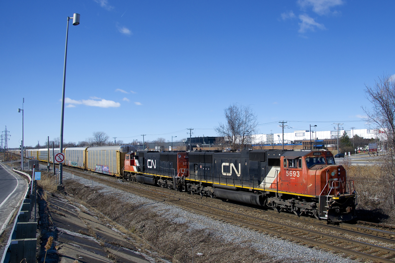 After being held a few miles west of Taschereau Yard for over an hour, CN 276 is on the move with SD75I's CN 5693 & CN 5731 for power and 112 autoracks.