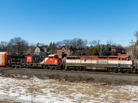 One of only eight BC Rail cowls that is still active leads CN X276 on CN's Kingston Sub, with relatively new CN 3235 trailing. With CN 276 just ahead of it and congestion in Taschereau Yard, it would be held out for a couple of hours.