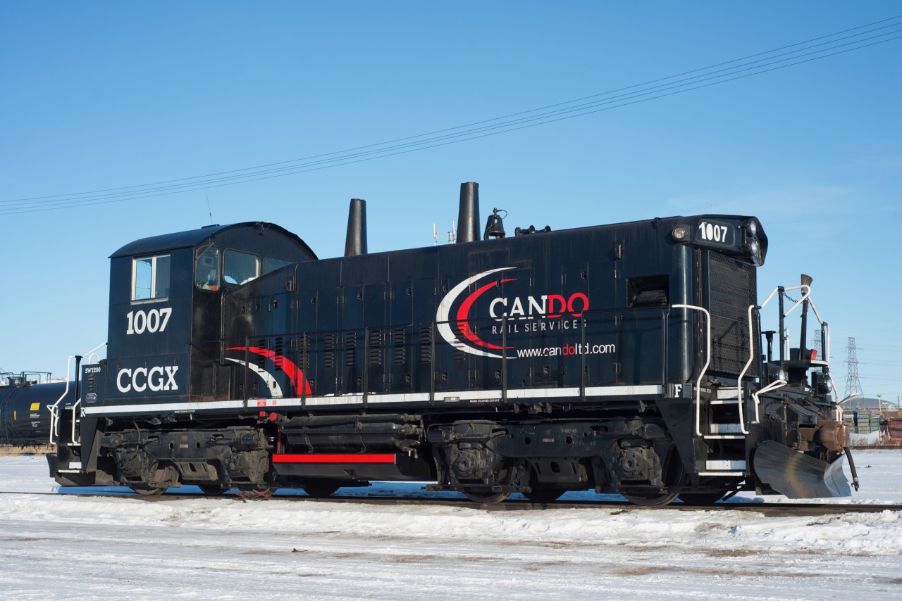 A rather clean CCGX 1007 soaks up the sun next to the CN Camrose Sub. This unit is one of a handful of Canada units assigned to Imperial's Strathcona Refinery which is directly behind me. The unit is exCP 1240 neeCP 8140.