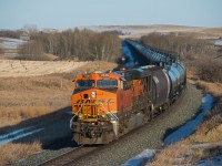 BNSF 7046 brings up the rear of an eastbound crude oil load between Biggar and Perdue Saskatchewan. 