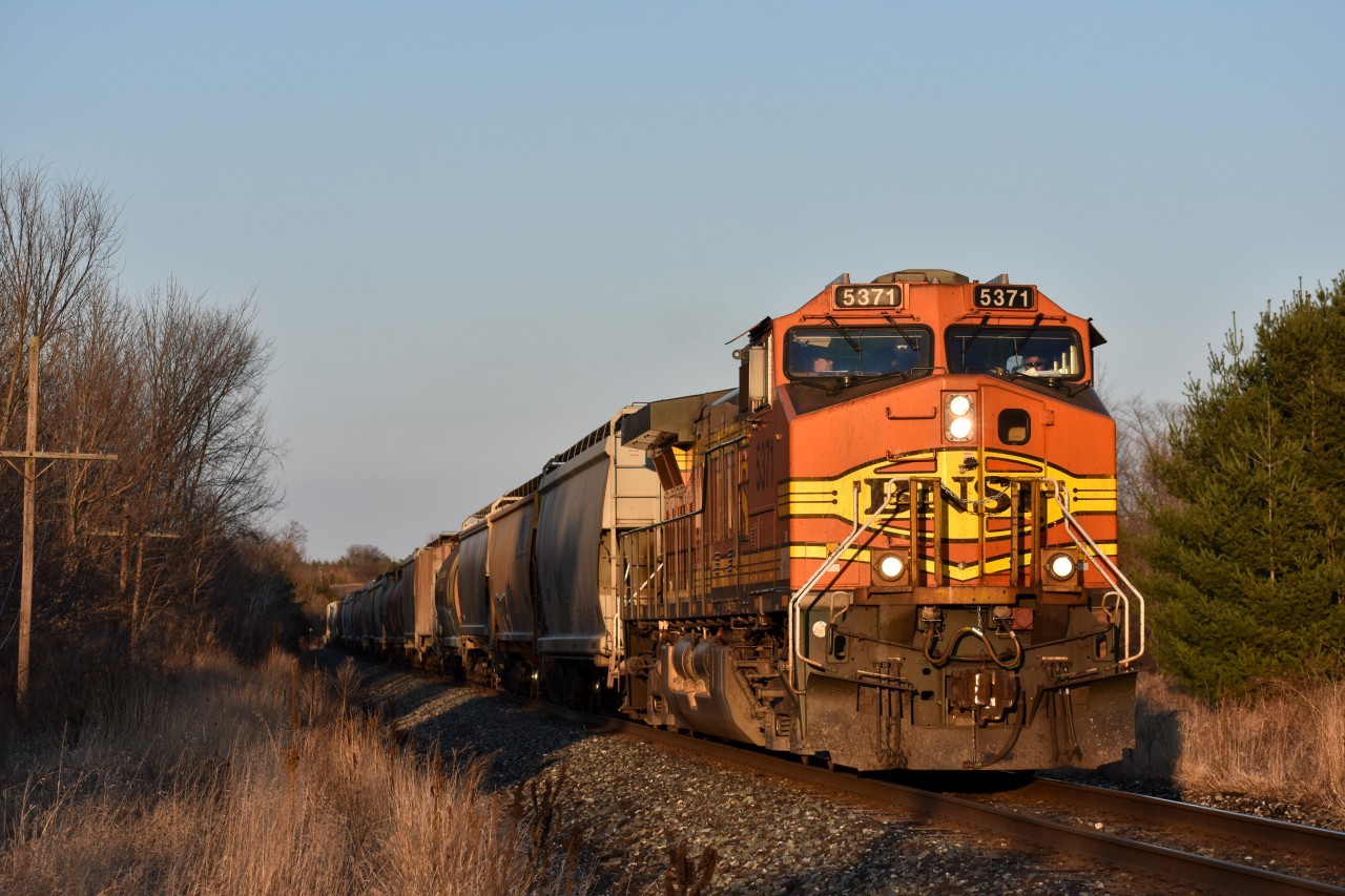 Yesterday I was out fanning in Leaside trying to catch as much of the backlogged intermodal trains as I could. I checked my phone at around 4:30 and figured out there was a solo BNSF dash 9 leading empty grain train 331 which had departed Smiths Falls at 1:30pm that day. I knew there would be a high chance it stops in Toronto Yard, maybe even gets a CP leader shoved on it, so we set out for somewhere east of Agincourt. I found the Reesor Road crossing on the map, a street which has both the CN York and CP Belleville cross it at track level, making the street a pretty good railfan spot, provided you have a car. Minutes after arrival, the sound of a K5HL horn fills the atmosphere, and with no more than 10 minutes of light left in the spot, the train made its appearance. This definitely has to be one of my favourite catches of the year so far, and the first time I haven’t felt the need to edit a shot in a while.