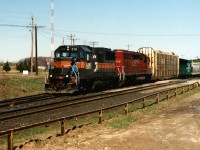 HATX 510 and CP 5604 slowly depart the back track at Ayr after taking the hole for a westbound that was following behind it. HATX GP40-2 510 would later go on to become Ontario Northland 2202 while CP SD40-2 5604 was retired in March 2008 and later scrapped. 