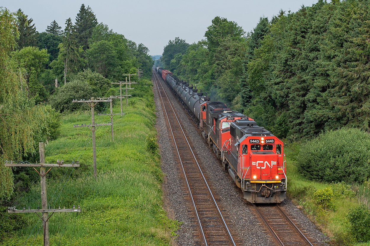 The derailment in the Sarnia tunnel had happened the day prior, and 382 and 383 were the lifelines for traffic in and out of Sarnia in the days that followed. Here is one such 382, with CN 5443 on point for the eastbound trip to Mac. If memory serves, they lifted nearly 100 cars in Aldershot on the way.
