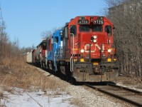 CN L540 is approaching Mill Street in Kitchener on the Huron Park Spur in early morning light. Powering the train are 4726, GMTX 2255 and 4761. GP38-2 4726, with its unique number-board, was set-off by the previous night’s A431. L540 would set-off all its cars at the interchange with Canadian Pacific and return light power back to the Kitchener yard. As a side note, to the very right is the Iron Horse Trans Canada Trail, which was once a section of CP's Waterloo Subdivision and saw it's last train in July 1993.  
