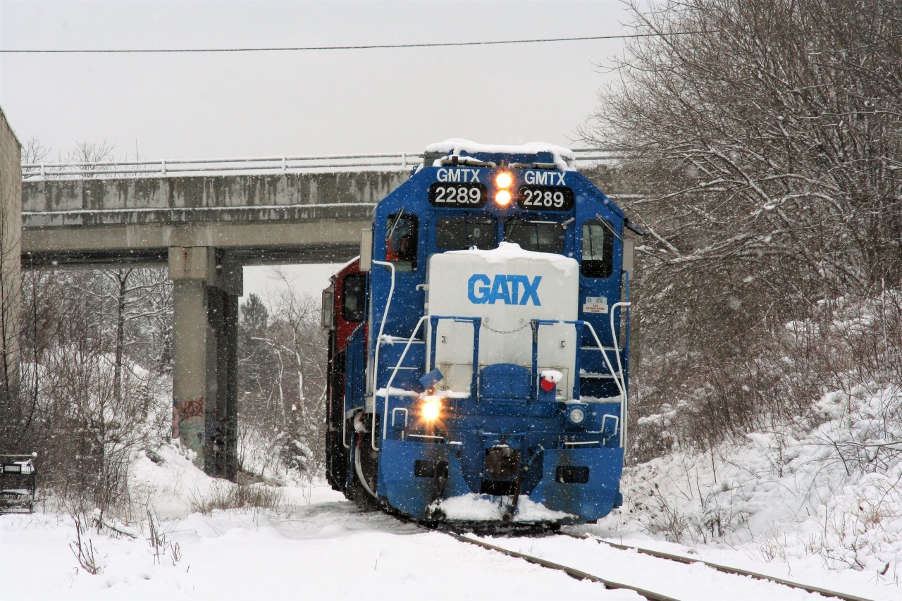 The calendar might say spring; however CN L568 is rolling through a winter wonderland on the Huron Park Spur in Kitchener as it approaches Madison Avenue. The train, powered by GMTX 2289, 7080 and 9675 had set-off cars at the interchange with Canadian Pacific in Kitchener as well as spotted one boxcar at Convoy Supply Limited. After returning on the spur light power to the Guelph Subdivision, the units would head westbound to Stratford.