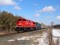 My grandson wanted to see a train that goes fast so off we ventured to try and catch a CP 651 we thought was coming. We were just approaching Moffat and my phone started going off steady but I was driving and couldn't answer. We got to the Conservation authority driveway and that's when I read about this guy. The sun is perfect, the train is good, the company is even better. CP 147 with SD70ACu CP 7028 and CEFX 1055 for power, accelerate out of Guelph Junction past Mountsberg with their load of auto racks headed to Wolverton. Even the horses stopped for a look. 