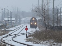 1001 passes through the Allandale Waterfront GO station on its way back to Utopia. Parking for the GO station is to the right of the tracks. Normally the 160 spaces are full before the last morning train leaves. Today the lot only had 20 cars.  