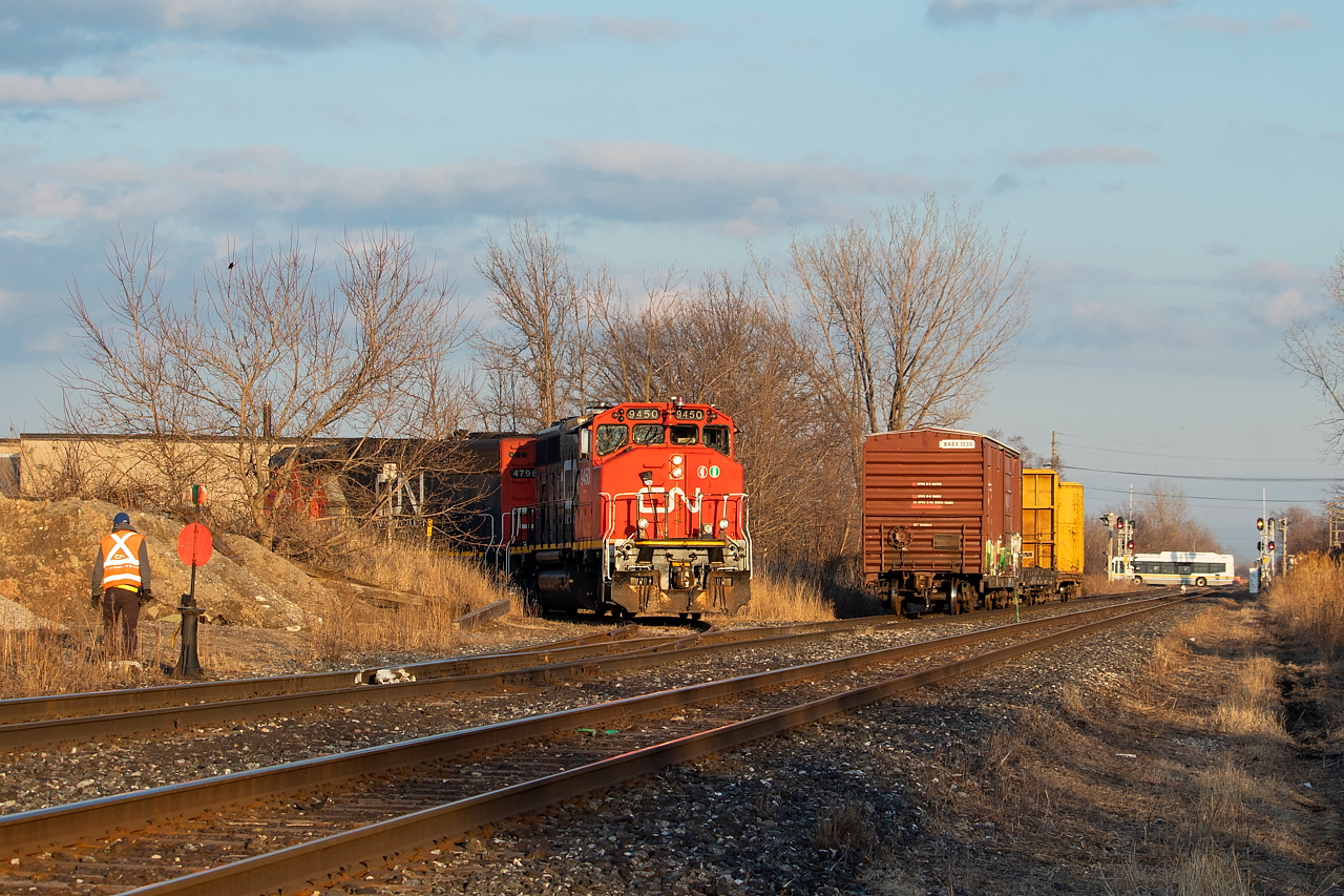551 is working off the north track of the Grismby Sub, having just spotted two boxcars at Pearce Warehousing (pictured at left) and is proceeding back out to the main where they will tie onto their train and head to Stuart for lunch. Just before, they had lifted the one boxcar pictured. Earlier in the evening, after setting off a few coils and one gon in Stuart, they had been working off the south track, lifting the pictured flat from somewhere (I believe Paddock Transport) and spotting two loaded centrebeams and lifting the one empty centrebeam from Bartram. After the lift at Bartram, they ran light power eastward out to Nelles where the crossed over the north track and proceeded back west to run around their train to allow them to work the off the north. This work was more recently handled by 555 at night, though I have seen the occassional Hamilton yard job at Pearce. Since 555 was shifted from being based in Hamilton to based in Aldershot and using 570's power, 551 has been serving the customers on the Grimsby Sub east of Parkdale Yard twice weekly. Should make for some nice shooting this Spring and Summer.
