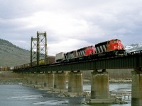 Westbound mixed freight 201 has just departed the yard and is crossing the North Thompson River in the Halston district of Kamloops. The river was once navigable but the lift span is now welded shut