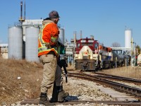 Brakeman Steve Bratina mans the switch at AOC looking onward as the conductor makes the joint on a loaded maleic acid tank car.  