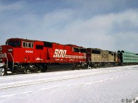 SOO SD60M 6060 and SD60 6013 handle a freight through Smiths Falls in February 1992. 6060 was one of five safety-cab equipped SD60M units ordered by SOO and built by GMD in 1989, after purchasing 58 of the standard cab version. They were later rebuilt by CP as 6200's and still operate today.
