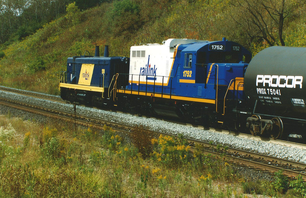 My dad had gone to Copetown this day to photograph trains on the Dundas Subdivision that were passing the empty space where normally the Inksetter Road bridge would be. At the time, the bridge was undergoing a complete overhaul and the road was closed at each end, making Copetown an even quieter spot for road traffic while the construction was happening. That day he shot the usual trains as would have been seen at the time, including NS 327 and NS 328, however there was one he photographed I wish I had been there for. It was a westbound Southern Ontario Railway (SOR) train with RLK 1200 and RLK 1752 heading-up the grade with cars for either Brantford or Paris from Hamilton. He does have photo of them returning as light power some-time after, so I imagine they set the cars off in Brantford and headed back east. This was the only time I had ever seen photos of SOR taking an actual train up the grade from Hamilton on the Dundas Subdivision; however it might have happened prior and maybe others on this site have even seen it.  Also, if anyone has any additional information on this move it would be appreciated and I also wish I had the exact date.