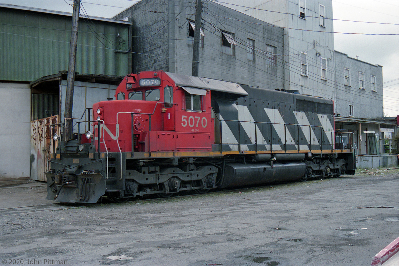 I came across this SD40 on my 1993 visit to Vancouver. It seemed an odd place to park a locomotive.
A nearby McDonald's could account for CN 5070 being here. The building was still there in 2019 street views
This is the stub of track extending west from CN's Vancouver Yard; in the past it served industries along the south side of False Creek and onto Granville Island.
The lands surrounding False Creek have been extensively redeveloped; most of the industry has gone.