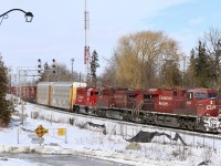 It's always nice when you find a new photo location that you never knew existed. Some recent brush cutting by CP recently opened up an old location that decades ago was actually a rail served industry. Redevelopment about a decade ago reopened the site to the public when a seniors apartment was built in one corner. A pair of condominiums was to be built on the remaining land but a mysterious fire destroyed the first building as it neared completion and the future of the site still remains in limbo with all construction frozen. This bitterly cold day I took to a large frozen dirt pile to capture CP 234 storming through town. Streetsville Junction can be seen beyond the signals, and the crossing there is for Ontario Street, which one-day may be closed if the street in the foreground is ever completed. 