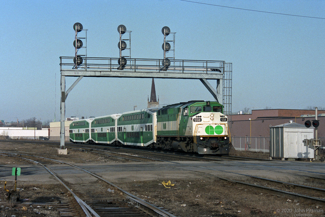 About a mile east of London station, GOT 558 leads 3 GO Transit bilevel coaches eastbound on the Dundas Sub.  Less than half the usual GO train length and a long way west of their usual GTA commuter routes.
However it is heading for Toronto Union station, just like many morning GO trains.
Apparently this is a scheduled VIA train operating with borrowed GO Transit equipment, during a period when VIA's LRC coach fleet was "grounded" for axle replacement.