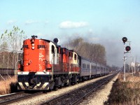 Peter Jobe photographed VIA #73 (Tempo) westbound in Mississauga, Ontario at 12:53 P.M. on October 31, 1980. It consisted of CN 3153, CN 3155, and eight cars.