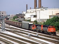 CN 9490, 9553 and 7732 are eastbound in Toronto on July 30, 1987.