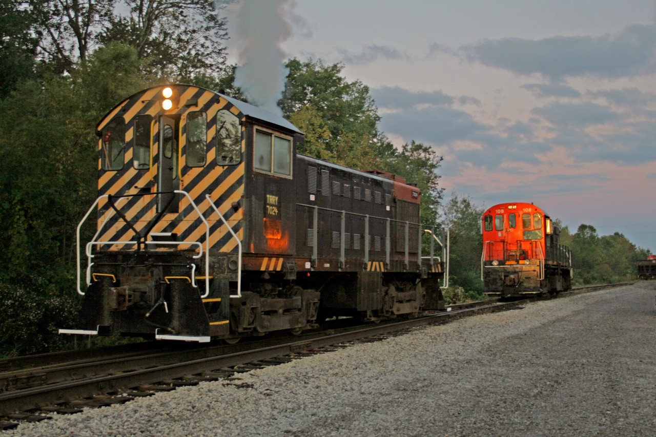 The sun is barely above the horizon as it casts a reddish glint on the cab of Alco S2 7024. The telltale " Alco smoke" shows the crew has just arrived and started their unit. Just down the lead, S 13 108 awaits another Trillium crew, on-duty an hour later. 7024 will today work the Canal-Harbour Job which will take her to Welland and St Catharines. 7024 has loads of miles and probably plenty of interesting stories. She started life in October 1944 !