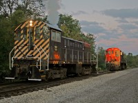 The sun is barely above the horizon as it casts a reddish glint on the cab of Alco S2 7024. The telltale " Alco smoke" shows the crew has just arrived and started their unit. Just down the lead, S 13 108 awaits another Trillium crew, on-duty an hour later. 7024 will today work the Canal-Harbour Job which will take her to Welland and St Catharines. 7024 has loads of miles and probably plenty of interesting stories. She started life in October 1944 !