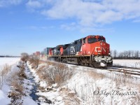 A nice overnight snowfall brightens up the day as IC 2700 and CN 2005 lead train 148 east out of Sarnia, ON.