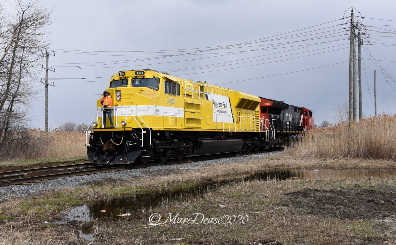 A strange turn of events today in Sarnia gave me the opportunity to catch one these EMD SD70ACe T4 Demonstrators leading although technically it is the trailing unit. X149 was held at Camlachie Sideroad because its power (IC 2458 and CN 2507) were not PTC equipped so they were not allowed to lead into the US. X149 came in light power and was swapped with what I believe was 482's power which is the EMDX 7201 Demo and CN 3200. So far these Demonstrator units have not led that I know of and today was no exception as this power had to wyed before being taken back out to lead X149 with the CN 3200 leading. Here they make their way around the west leg of the wye in Sarnia. Despite the dreary conditions these units sure stick out.