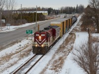 OSR’s St Thomas Job has finished departing Putnam after switching a local propane supplier in the town. The 3 of us chased it down it’s straight run to St Thomas where the train will switch out the TTX boxcars on the head end at Messenger Freight then go on back to Ingersoll within the hour. The K3 horn from the ex SOO GP7 shattered the area as the engineer starting blowing for the crossing about 500 meters past the Highway 401 bridge. It was overall a gloomy day to chase OSR but this shot and a few others would’ve been in pretty harsh backlight if it wasn’t for the clouds. The Cayuga Clipper was already out of St Thomas at this point which we chased after this train started proceeding north back to Ingersoll meeting up with more of the guys on the way in the late afternoon. For me anyway, it’s good to grab lots of shots of runs that don’t occur daily at all as you know their day’s aren’t numbered, but their future isn’t as stable as something you would see on a class one rail line. OSR is rumoured to be ceasing operations down the Cayuga Sub at the end of the month so ignoring the lighting conditions, I’m glad we all had a good chase for something that is soon to be abolished quickly. 