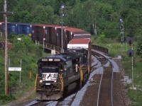 NS 328 hangs a right onto the cowpath amidst it's journey from St Thomas ON to Buffalo NY. Lead unit NS 8698 is a C40-8, a model now extinct from the NS locomotive roster. In my experience 328 generally ran like clockwork and was a pretty reliable sight at Hamilton West. 