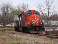 CN 4129 backs a handful of interchange cars into the CP Chatham Yard, passing by the former site of the C&O Chatham Depot. 