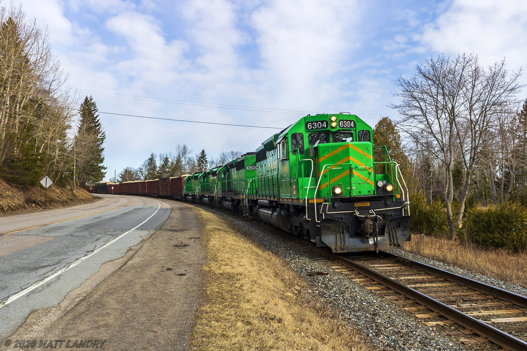 NBSR 6304, ex HLCX, leads a late New Brunswick Southern Railway eastbound freight approaching the car ferry at Grand Bay-Westfield, New Brunswick.