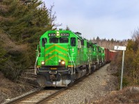 NBSR 6304 is passing the milepost at mile 7, getting handy to it's final destination of Saint John, New Brunswick. Mile 7 is Ketepec, a few miles to the north of Saint John. 