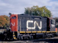 For a brief period in the late 1990s, Sweeps found work in Halifax, Nova Scotia, often in the mu company of SW1200RS units.  The odd couples worked the container piers, transfers and general switching at Rockingham Yard and downtown, at the Ocean Terminals. <br> <br>

At 3.30 p.m. on Sunday, October 26, 1997, CN 7104 rests on the radial tracks at the Fairview Roundhouse. <br> <br> 

CN assembled the 7104 from major components of SW1200RS 1248, GMDL 11-1956 #A1020, the first of 21 units in class GR-12h.  It was retired in 1986, rebuilt at Point St. Charles and released as 7104 on Friday, May 1, 1987, with class GS-412b.  It was retired on Friday, February 29, 2000, and joined the Canac / Savage lease fleet, where it remains active.