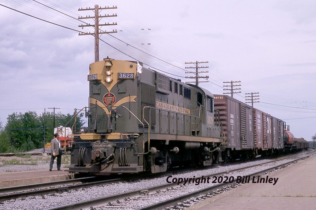 The 3628 is westbound with an 18 car midday extra trailed by van 79022.  The MLW RS-18 was built as a group of 54, 3617 - 3670, built in the second half of 1957 as class MR-18b following the successful demonstration of the 3615 and 3616 beginning in December 1956.  Built 8-1957 serial 82139, the unit was geared for 75 mph and equipped with dynamic brakes. It was assigned to Moncton, NB in August 1979.