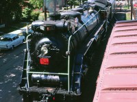 Northern-Type #6167 was built in 1940 and served as Canadian National’s steam ambassador from 1960 to 1964.  Photographer Del Rosamond didn’t date this large format slide but did record that it was captured in Lindsay, Ontario.  Internet research shows two UCRS excursions to Lindsay – one on 07/09/61 and the other on 06/20/64.  I’ve guessed the date of this image to be the latter.  Perhaps the parked automobiles might provide a hint?
<br>
<br>
Digital scanning and image restoration courtesy of Mr. Raymond Farand.
