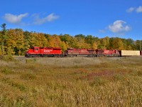 Amidst colourful fall foliage 235 makes it's tail end lift of multis at the west end of Wolverton before taking off westbound for London.