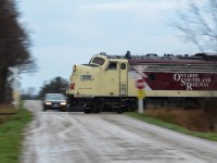 OSR’s Tilsonburg Job is seen blasting through Walker Road in the fields of Southern Ontario after lifting one tank car from IGPC Ethanol in Aylmer. Hard to believe this is it. This is the last (OSR) run on CN’s Cayuga Sub that’s seen many Wabash/N&W/NS run through trains in it’s time prior to the early 90’s. OSR’s plans to cease operations on the line between St Thomas and Tilsonburg really looked like reality today as they cleared every single tank car from Tilsonburg Yard on it’s return trip to St Thomas. It was great shooting it and it will truly be interesting to know what the future of the former “Air Line” has to offer. As a note, the motion blurred Mazda in the shot is RP contributes Mike Molnar and Alex Sanders who clearly lost the race to the intersection against 6508. 